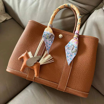 Top 3 Must-Have Accessories for Your Luxury Handbag