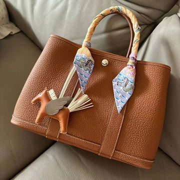 Top 3 Must-Have Accessories for Your Luxury Handbag